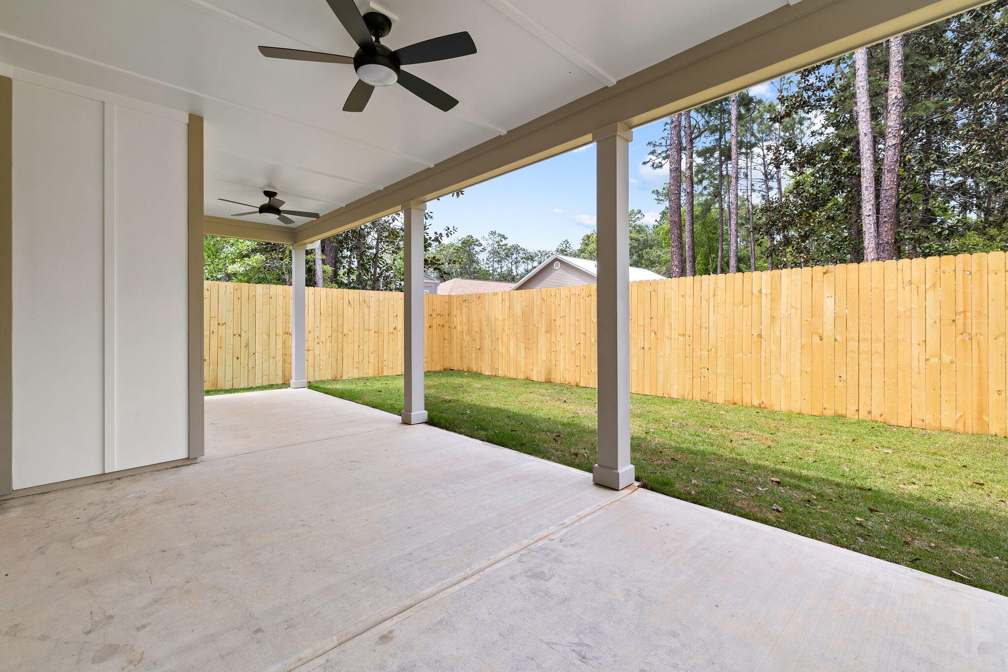 22 Georgie Street Point Washington, FL 32459 - Photo 18 of 57 a view of a room with porch and wooden floor