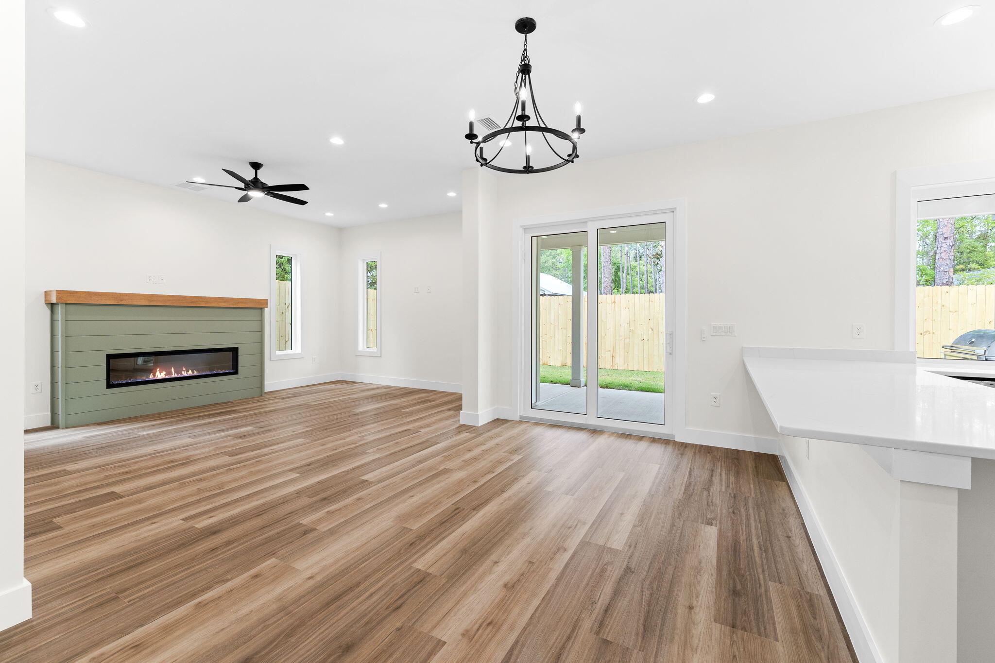 22 Georgie Street Point Washington, FL 32459 - Photo 2 of 57 a view of an empty room with wooden floor fireplace and a window