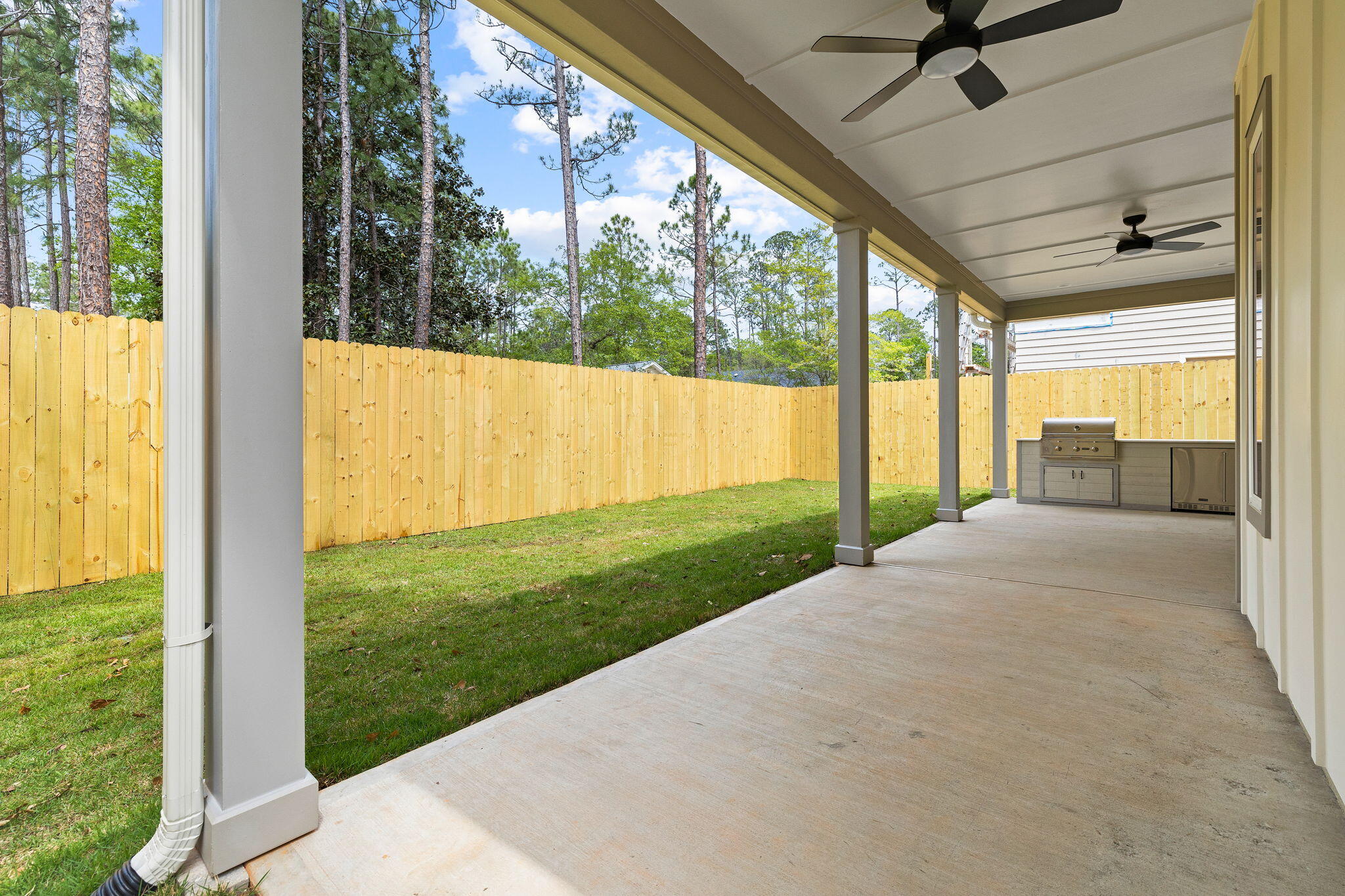 22 Georgie Street Point Washington, FL 32459 - Photo 19 of 57 a view of porch with a floor to ceiling window and a yard