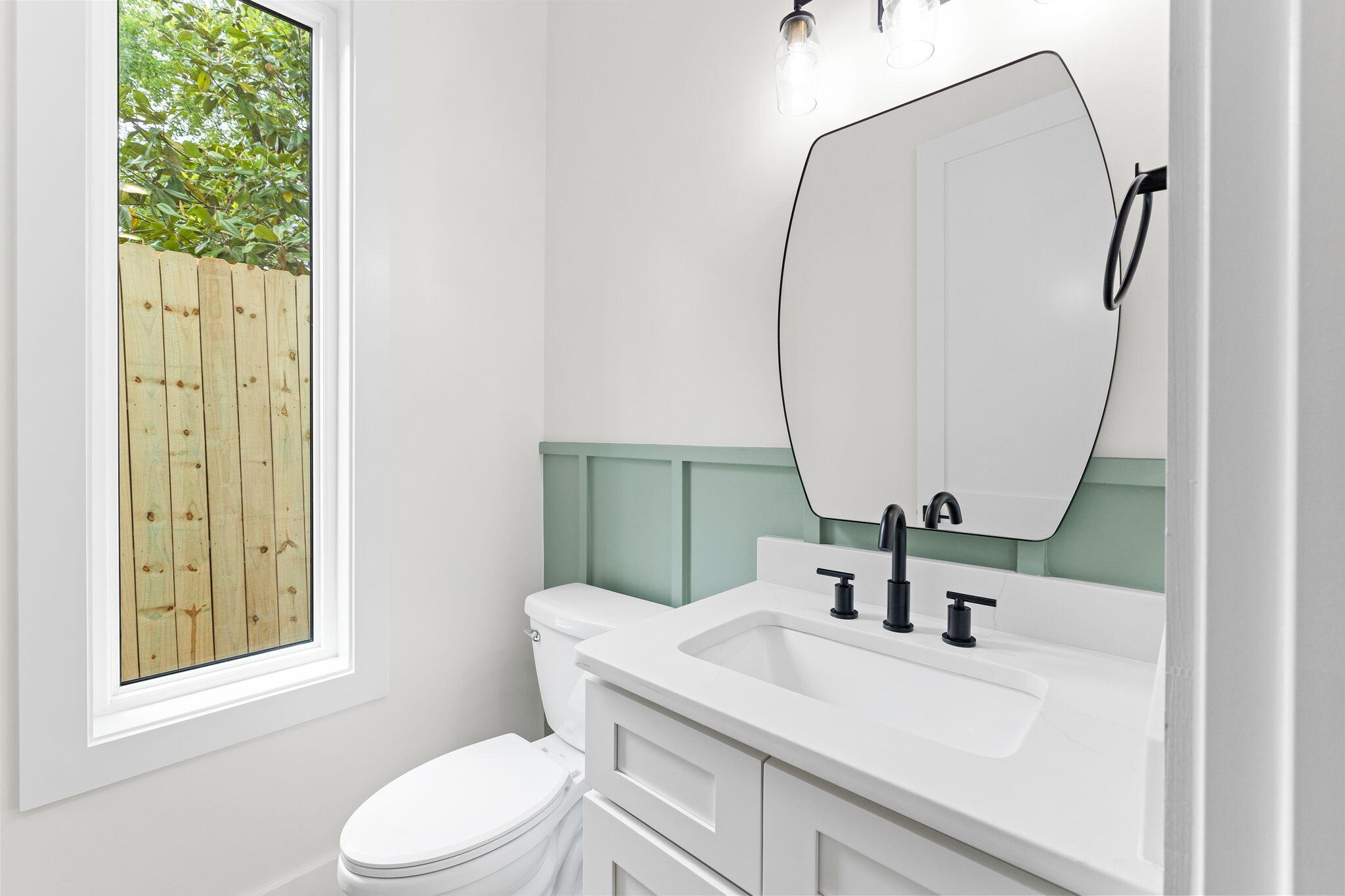 22 Georgie Street Point Washington, FL 32459 - Photo 22 of 57 a bathroom with a sink vanity mirror and toilet