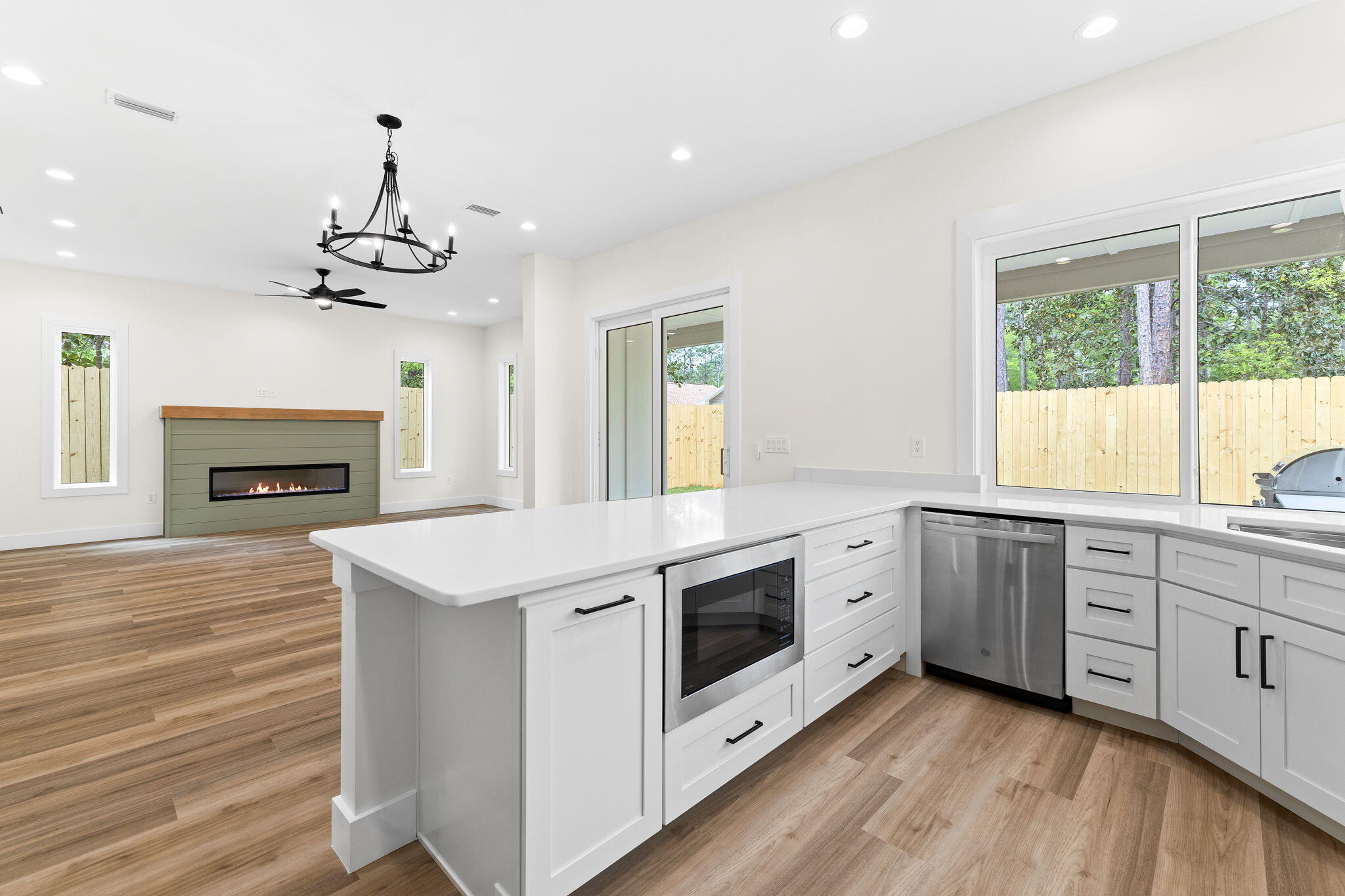 22 Georgie Street Point Washington, FL 32459 - Photo 27 of 57 a kitchen with a stove cabinets and wooden floor