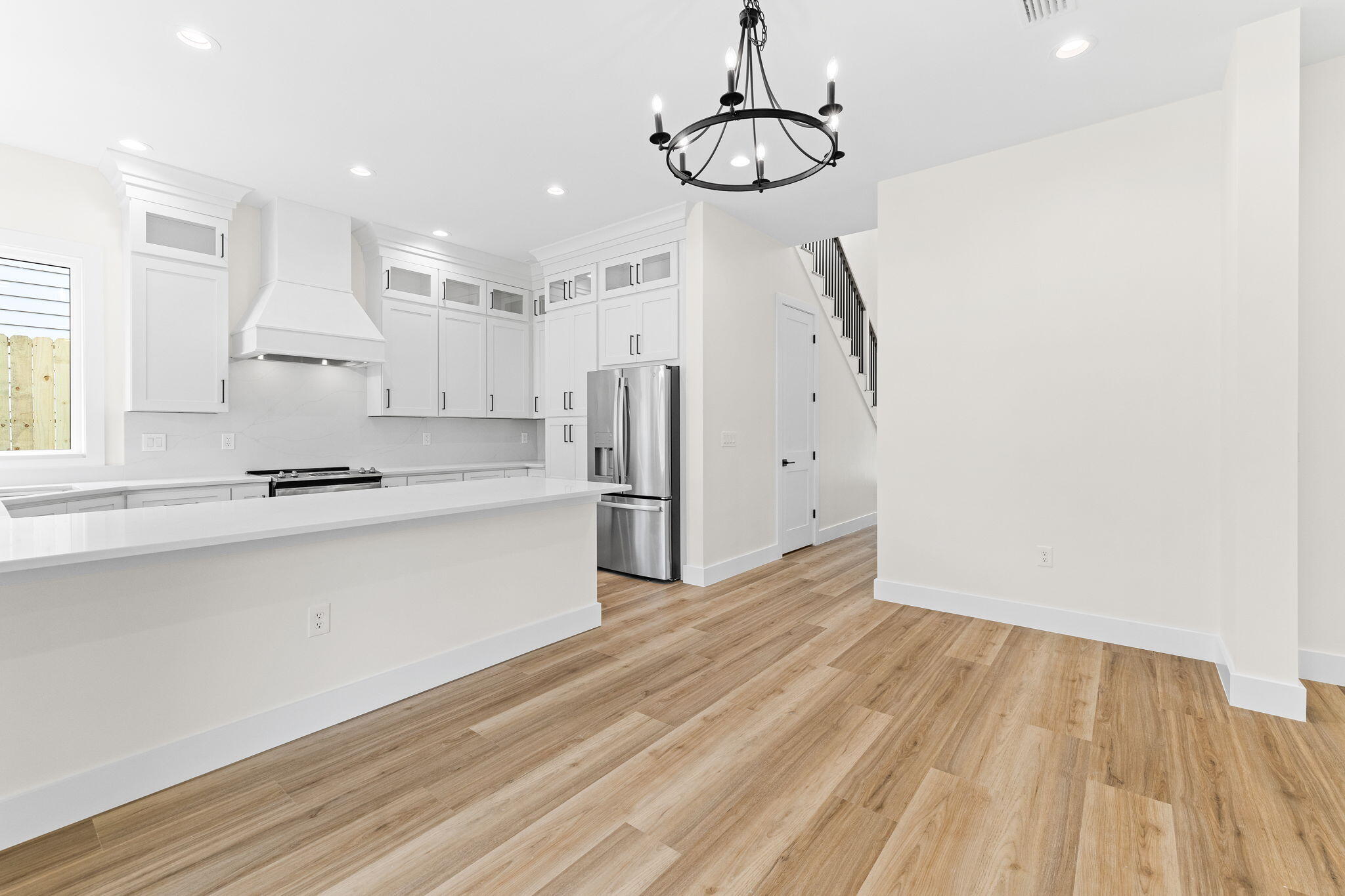 22 Georgie Street Point Washington, FL 32459 - Photo 28 of 57 a kitchen with stainless steel appliances a refrigerator and a stove top oven