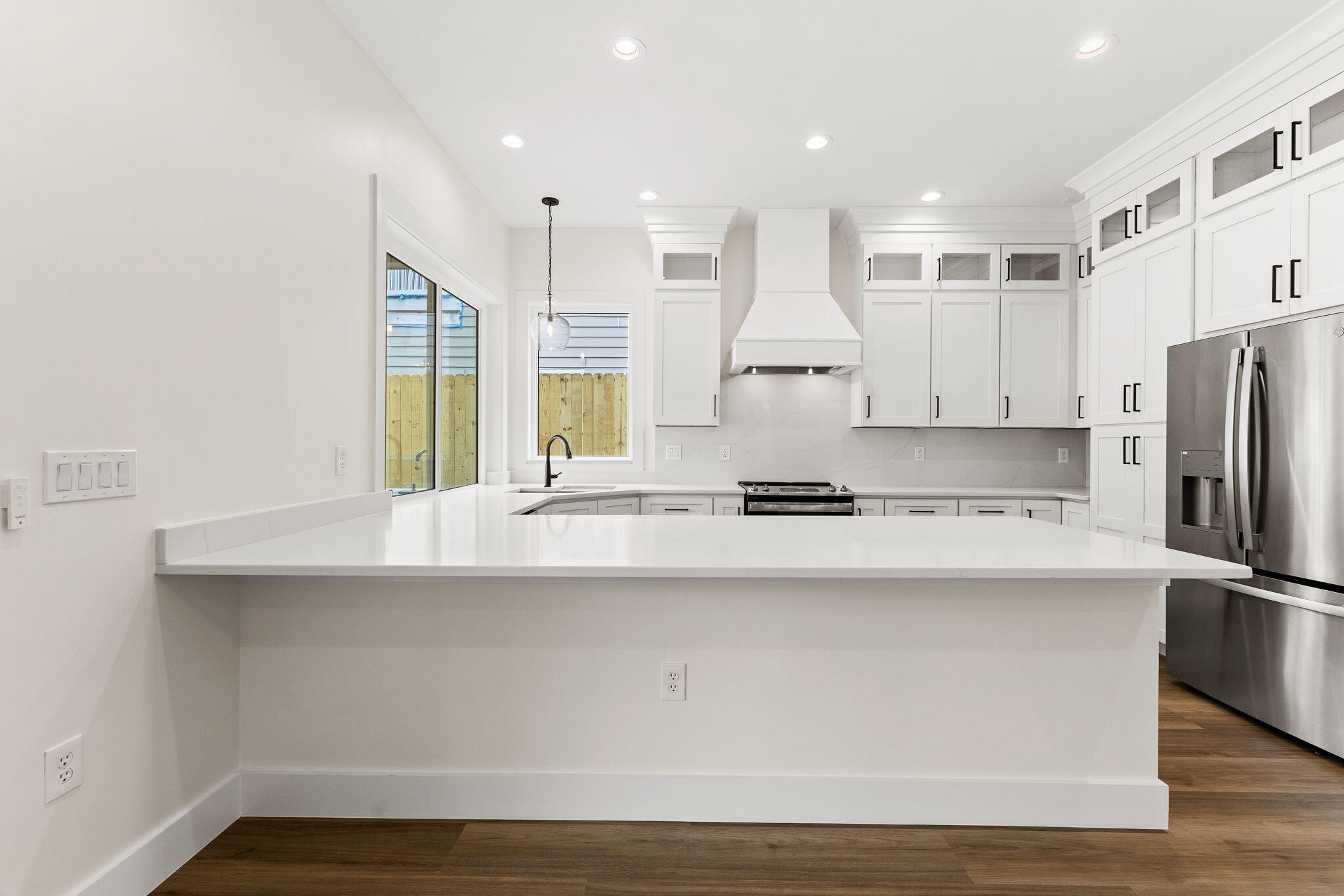 22 Georgie Street Point Washington, FL 32459 - Photo 3 of 57 a kitchen with stainless steel appliances a sink a stove a refrigerator and white cabinets
