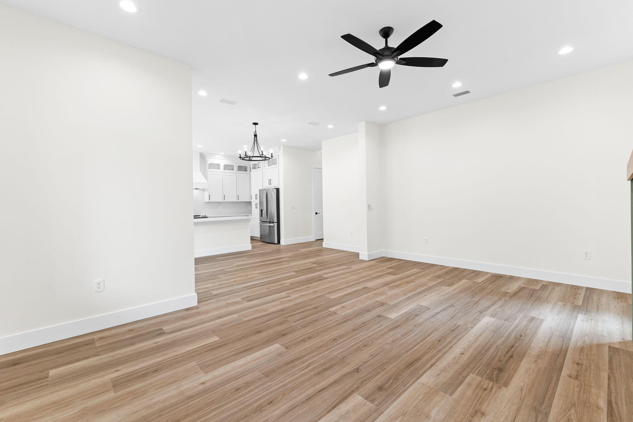 22 Georgie Street Point Washington, FL 32459 - Photo 30 of 57 a view of a livingroom with a ceiling fan wooden floor and a ceiling fan