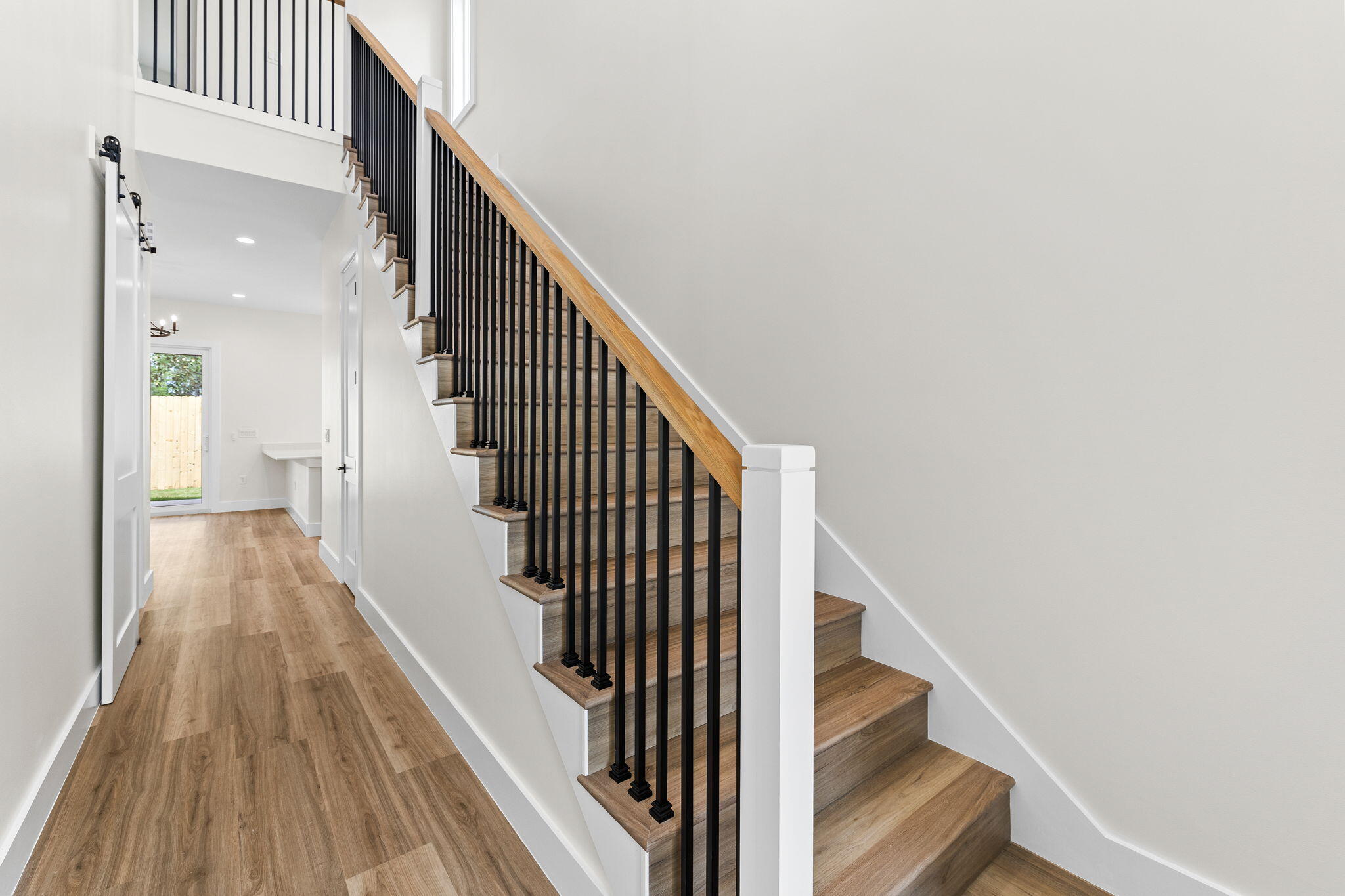 22 Georgie Street Point Washington, FL 32459 - Photo 34 of 57 a view of entryway and gallery with wooden floor