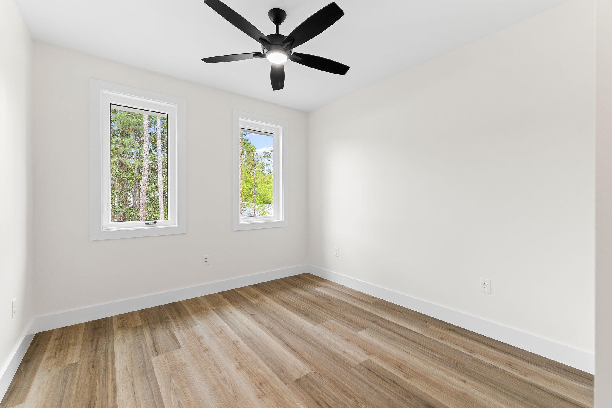 22 Georgie Street Point Washington, FL 32459 - Photo 35 of 57 an empty room with a window and a ceiling fan