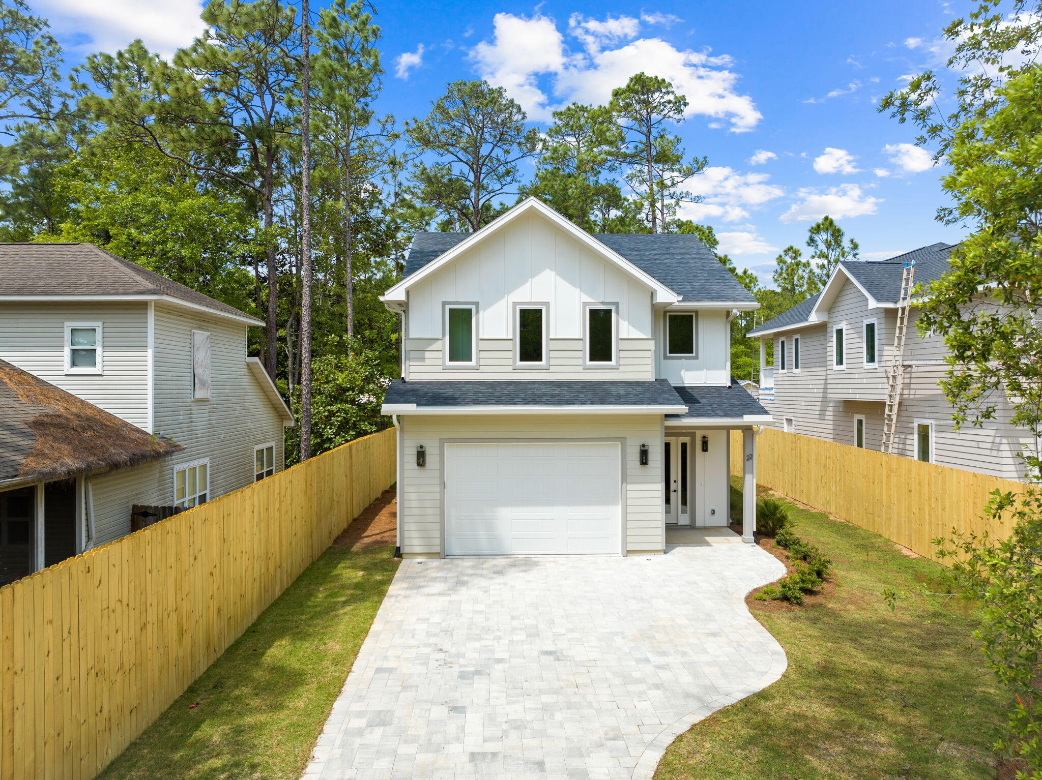 22 Georgie Street Point Washington, FL 32459 - Photo 4 of 57 a front view of a house with a garden and yard