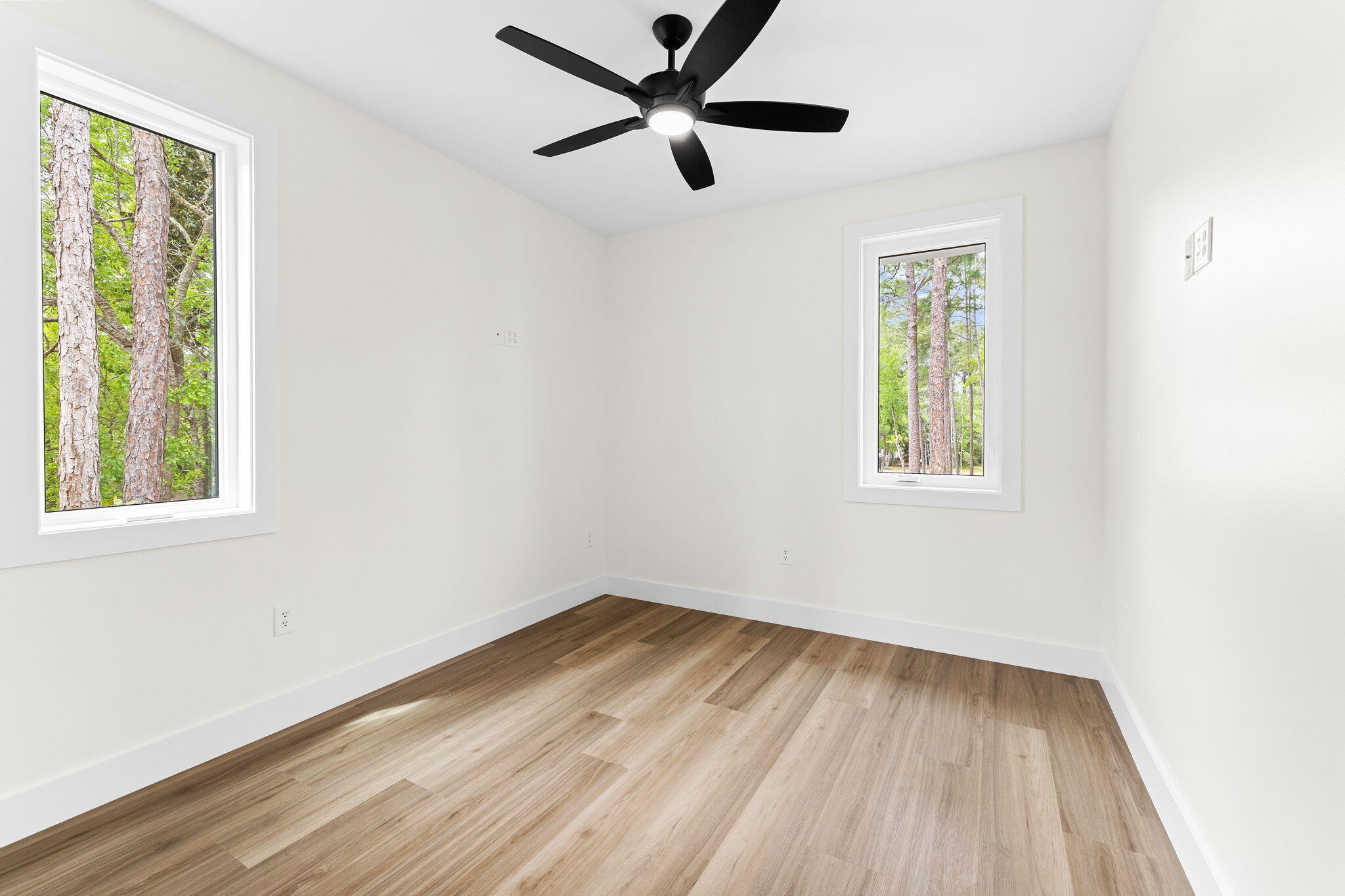 22 Georgie Street Point Washington, FL 32459 - Photo 40 of 57 wooden floor in an empty room with a window