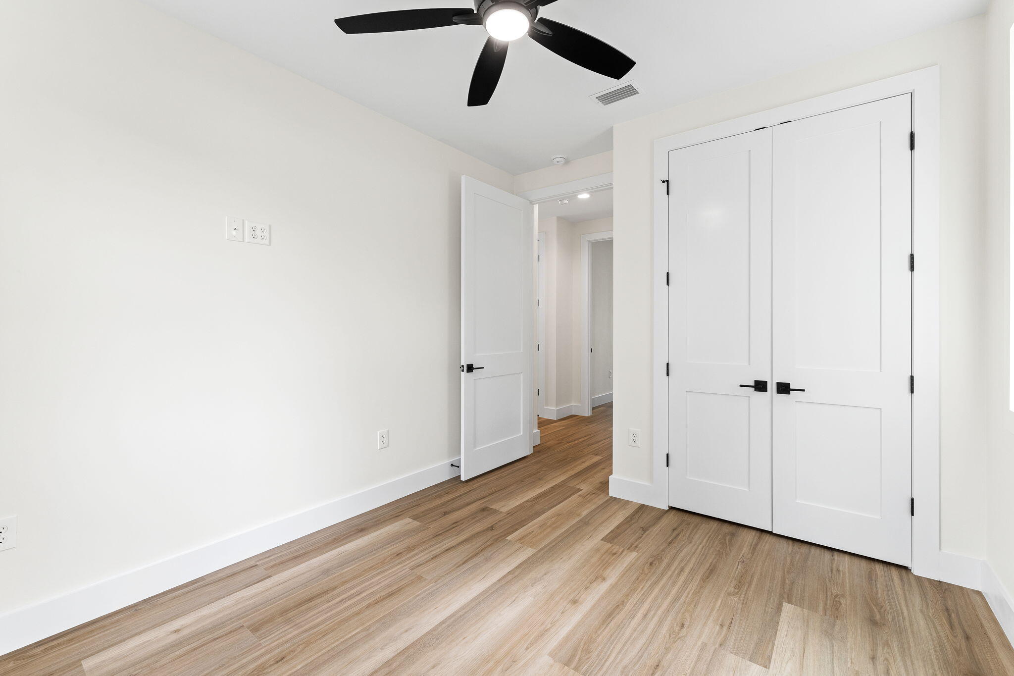 22 Georgie Street Point Washington, FL 32459 - Photo 41 of 57 a view of empty room with wooden floor