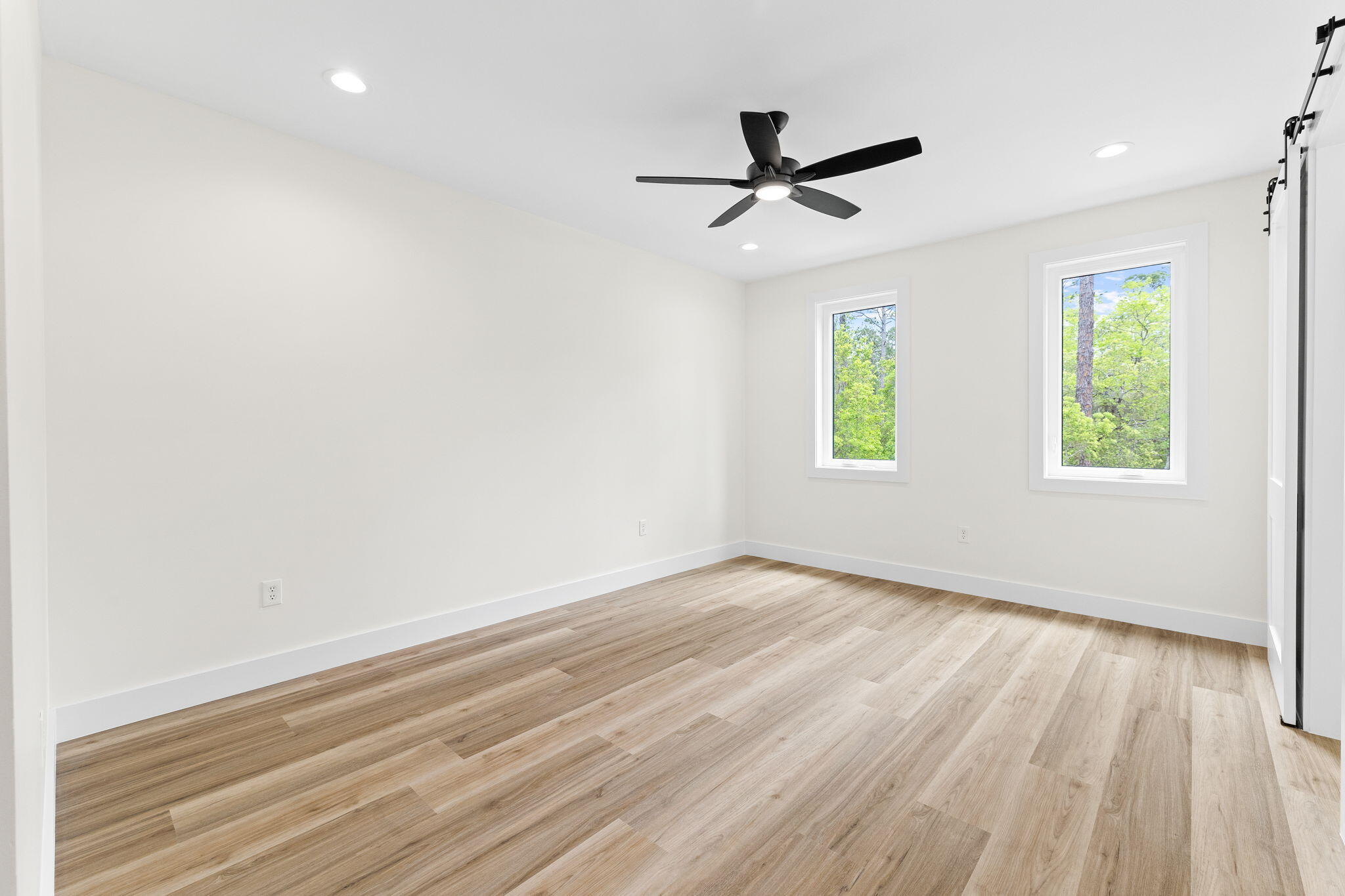 22 Georgie Street Point Washington, FL 32459 - Photo 42 of 57 wooden floor in an empty room with a window