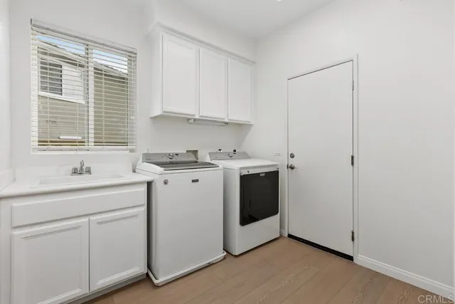 a view of cabinets with wooden floor