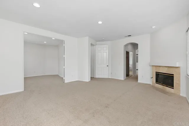 an empty room with fireplace