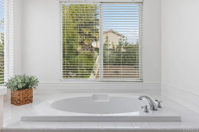 a bathroom with a bathtub and shower