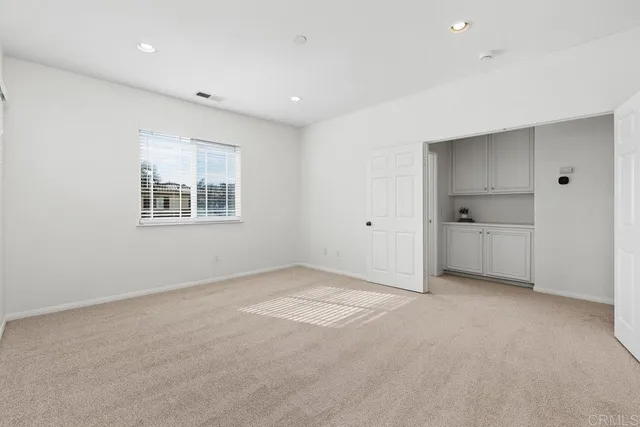 a view of empty room with windows