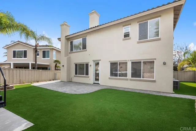 a view of house with a yard