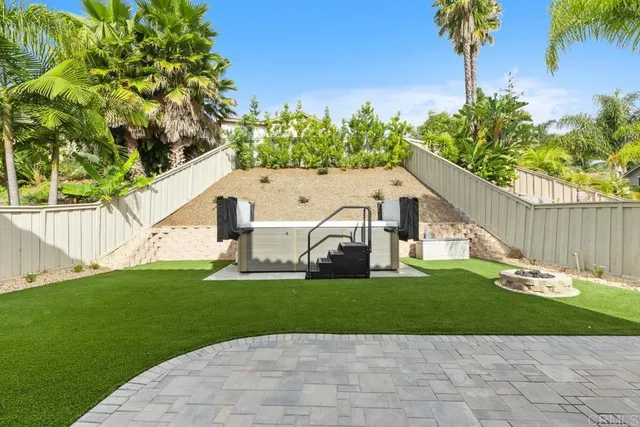 a house that has a tree in front of it