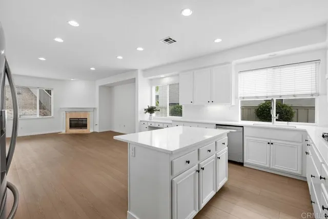 a kitchen with sink stove and microwave