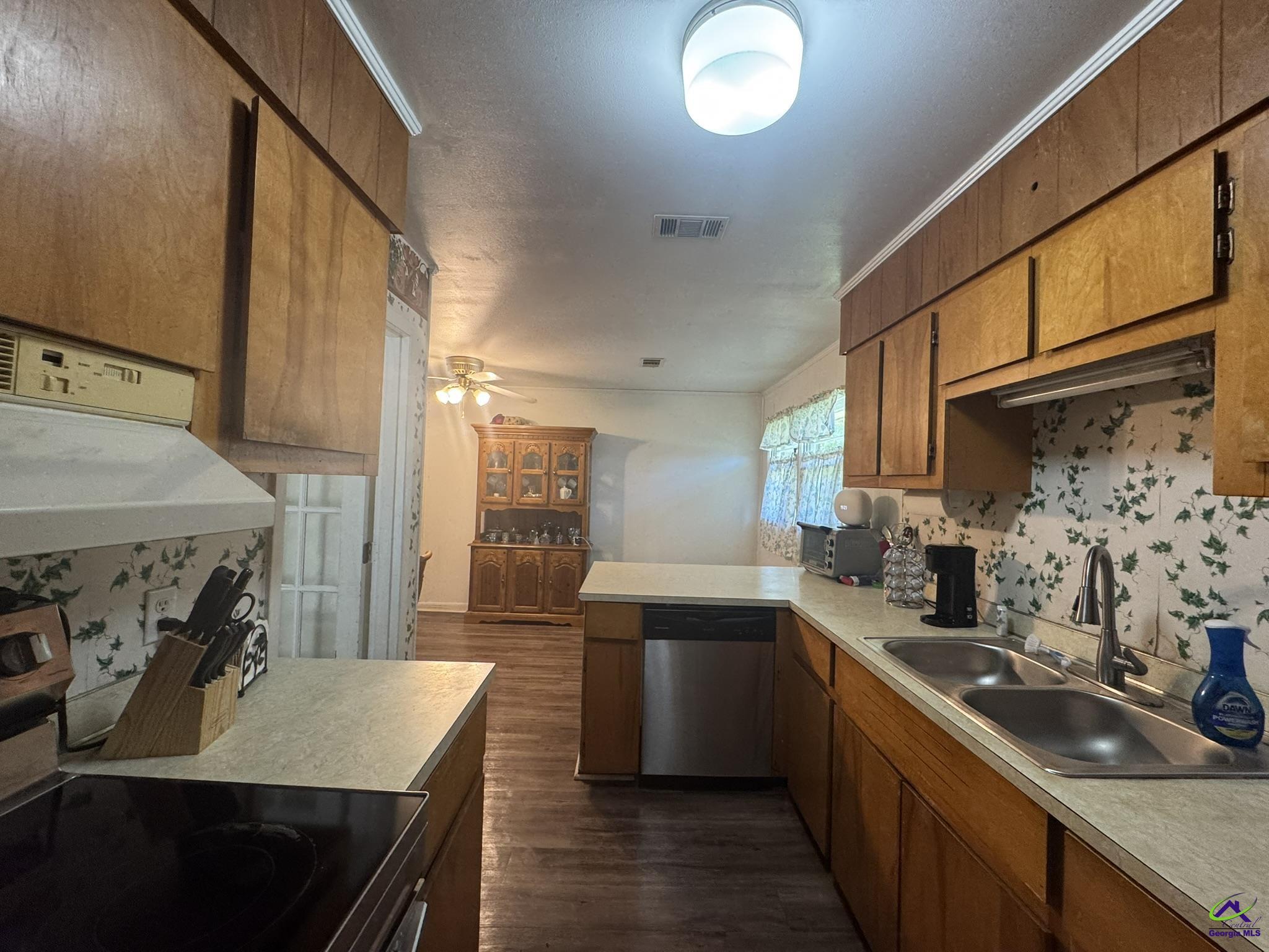 1032 Elberta Road Warner Robins, GA 31093 - Photo 9 of 26 a kitchen with sink stove and cabinets