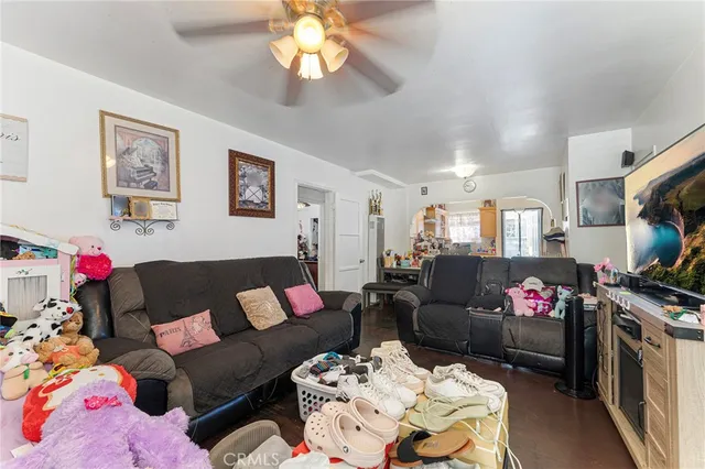 a living room with furniture fireplace and a flat screen tv