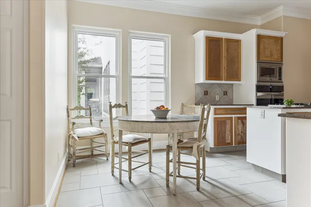 a kitchen that has a sink and a stove in it