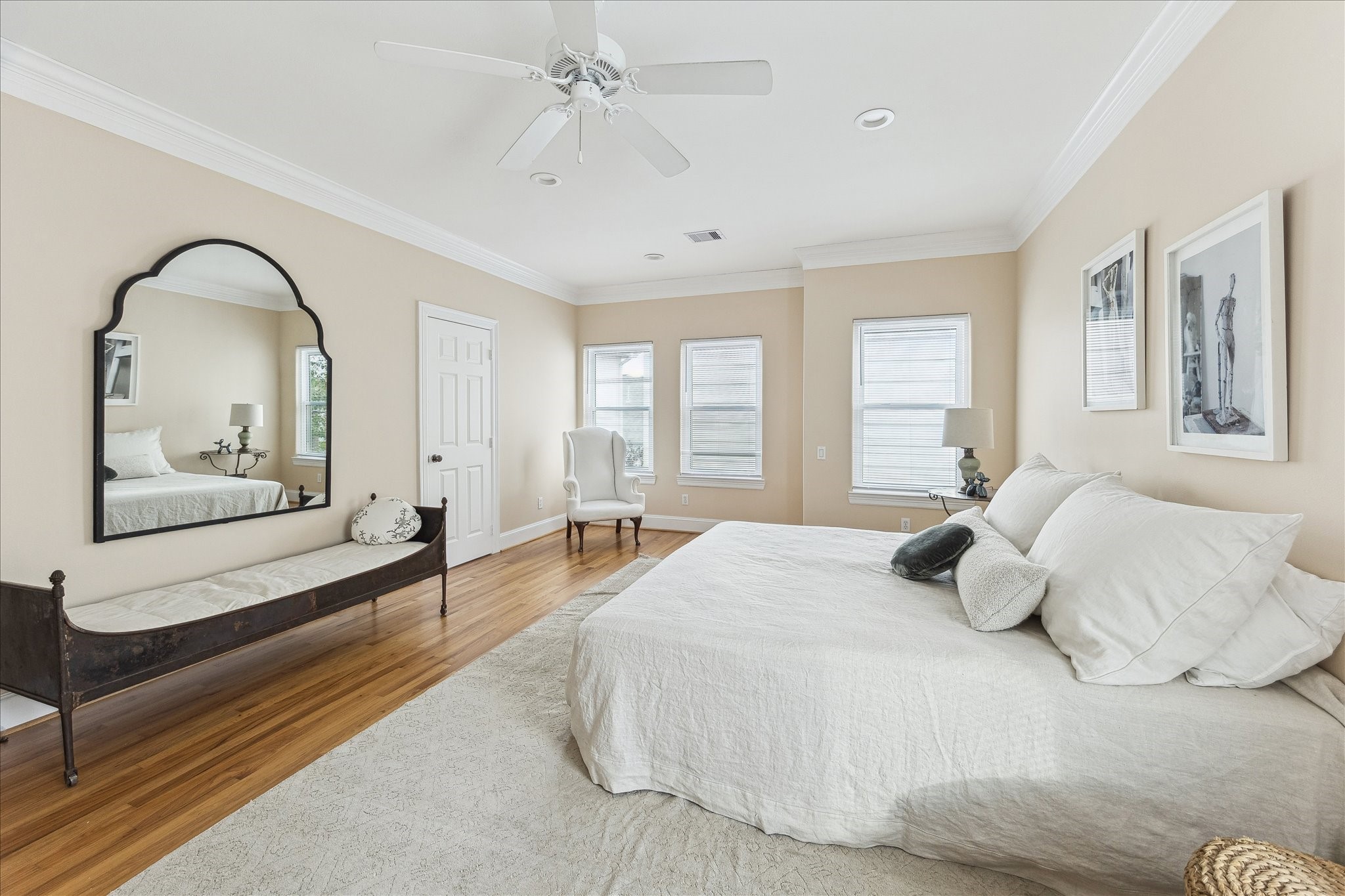 3515 Yupon Street Houston, TX 77006 - Photo 18 of 41 a bedroom with a bed and wooden floor