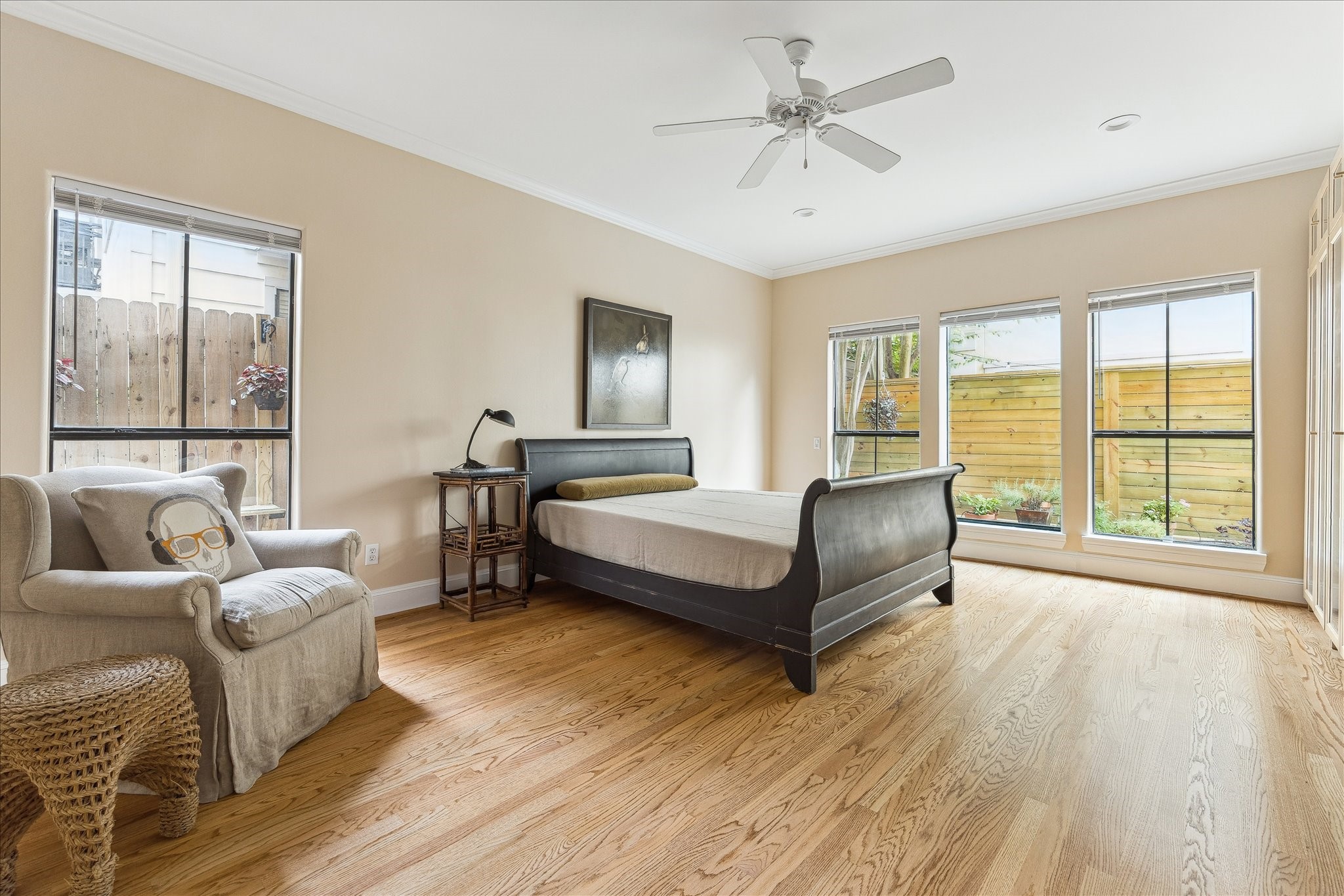 3515 Yupon Street Houston, TX 77006 - Photo 23 of 41 a spacious bedroom with a bed a couch and a large window