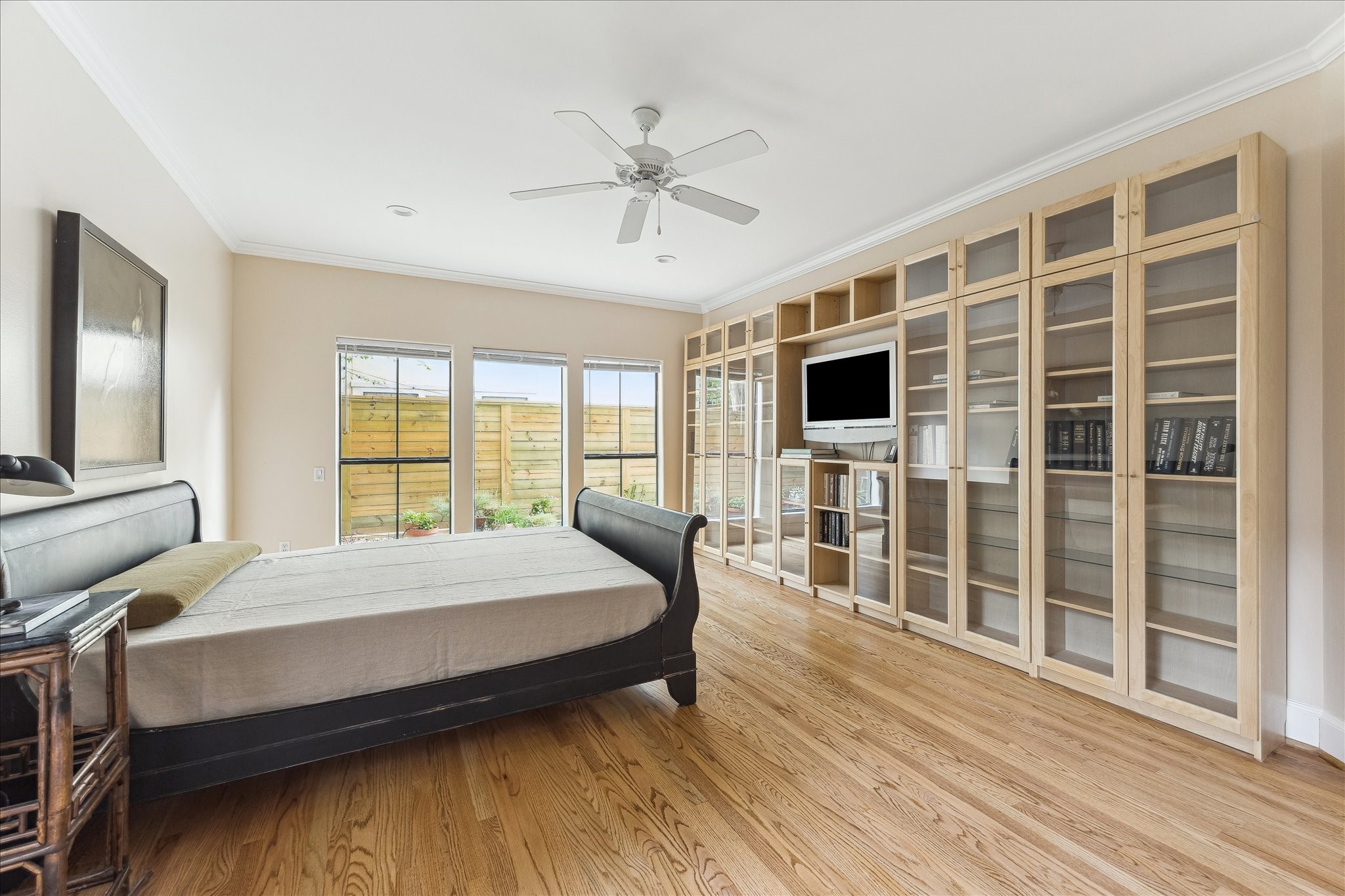 3515 Yupon Street Houston, TX 77006 - Photo 24 of 41 a bedroom with a bed and wooden floor