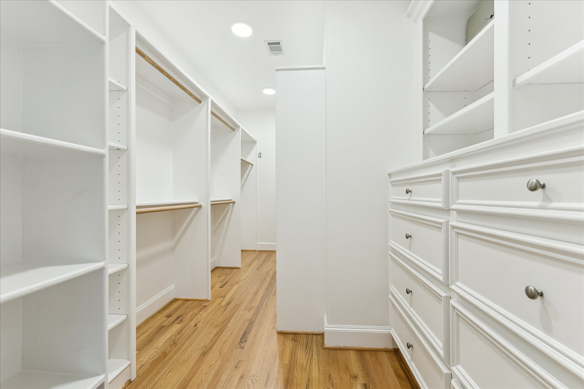 3515 Yupon Street Houston, TX 77006 - Photo 26 of 41 a view of walk in closet with empty racks