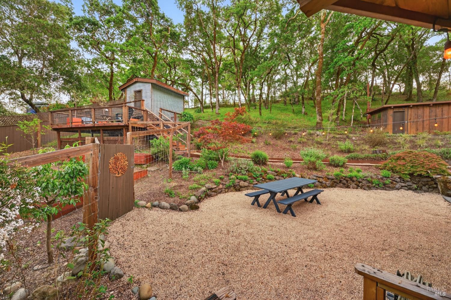 116 Hill Road Glen Ellen, CA 95442 - Photo 36 of 48 Spacious dining area aside the kitchen. Gated entry to growing garden. Above left is storage/hobby building with view deck. Above right is detached garage/shop and a large parking area.