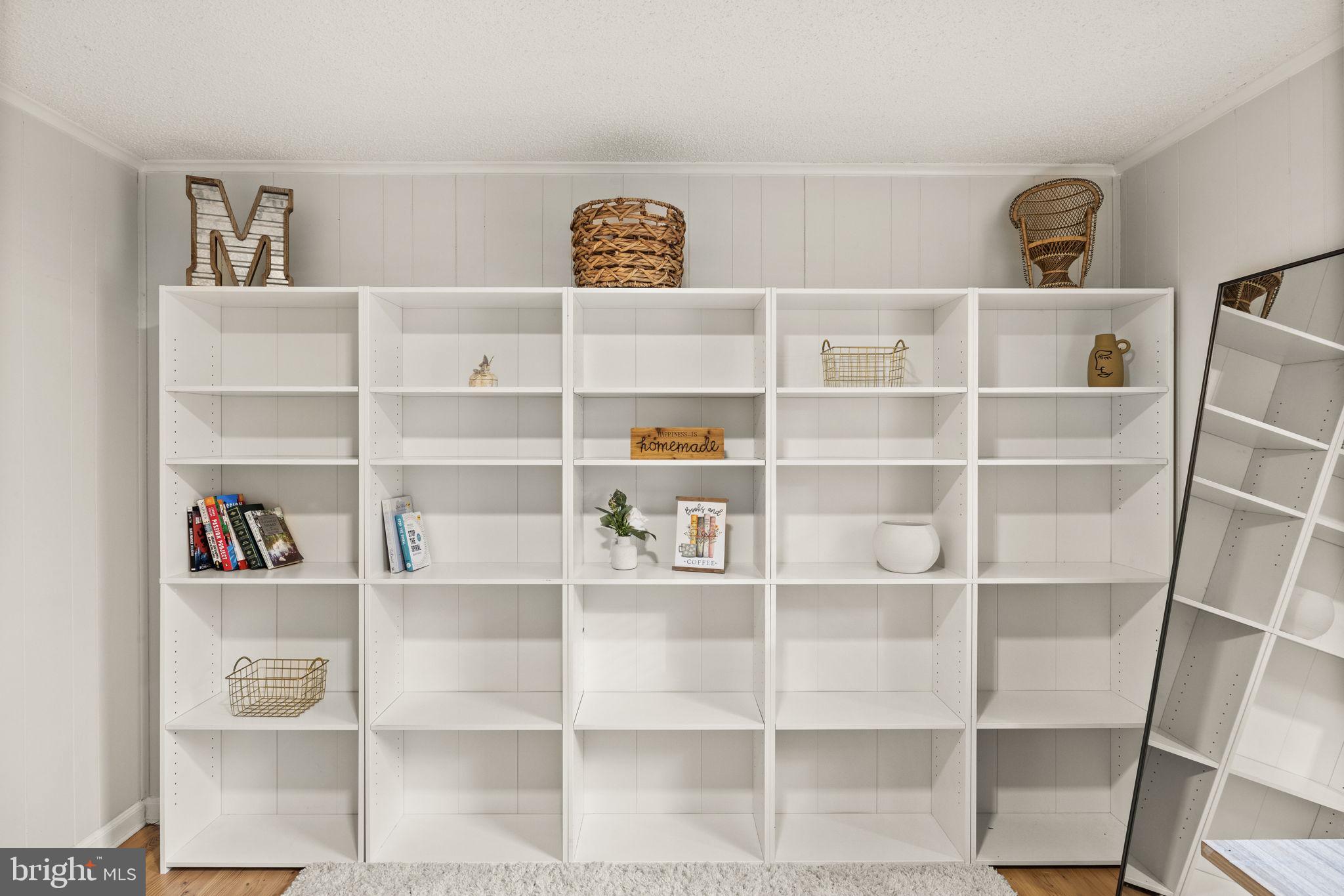 9523 Brock Road Spotsylvania, VA 22553 - Photo 33 of 44 a view of a closet with shelf and book shelf