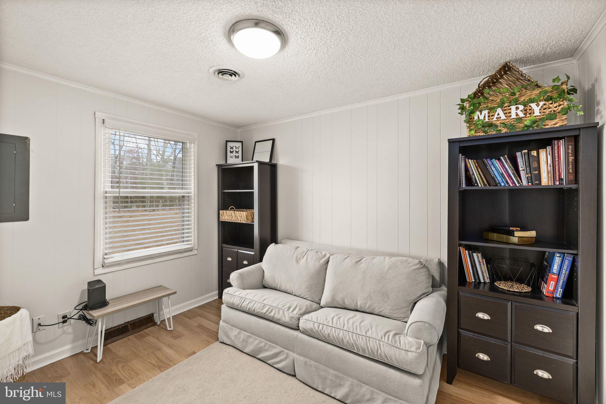 9523 Brock Road Spotsylvania, VA 22553 - Photo 35 of 44 a living room with furniture and a flat screen tv