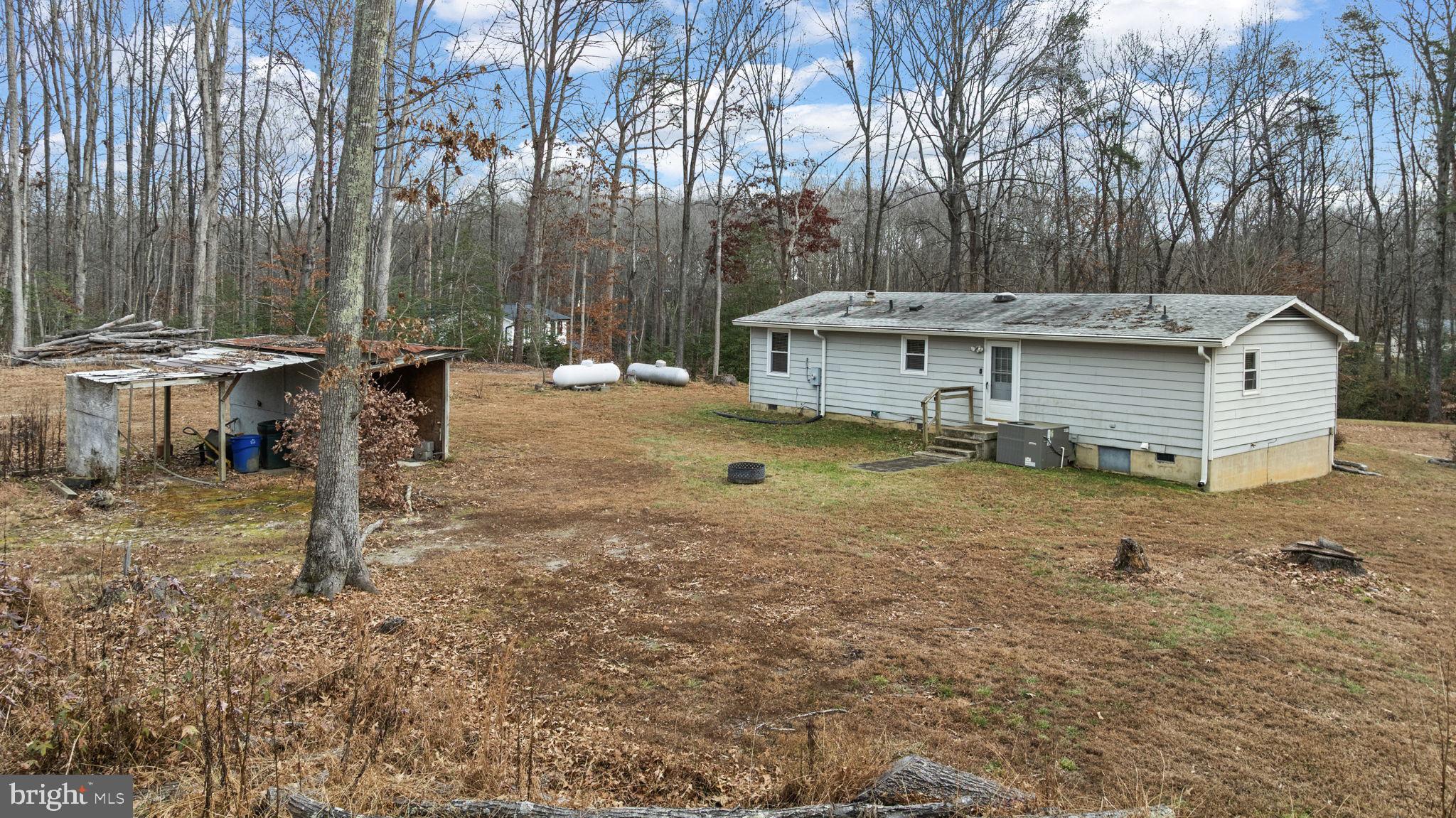 9523 Brock Road Spotsylvania, VA 22553 - Photo 38 of 44 a view of a house with backyard and sitting area