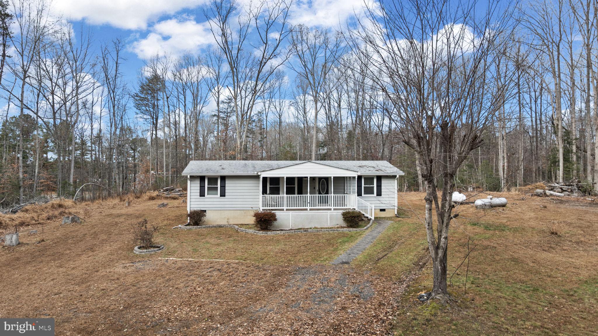 9523 Brock Road Spotsylvania, VA 22553 - Photo 5 of 44 a view of a house with a yard covered in snow