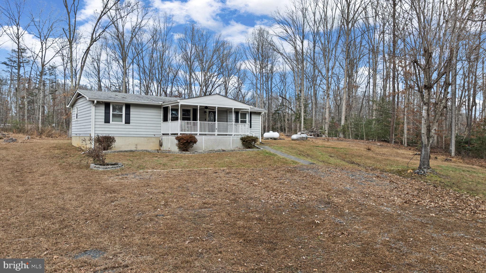 9523 Brock Road Spotsylvania, VA 22553 - Photo 6 of 44 a view of a house with a yard
