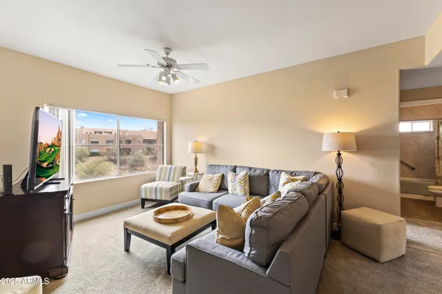 a living room with furniture and a window