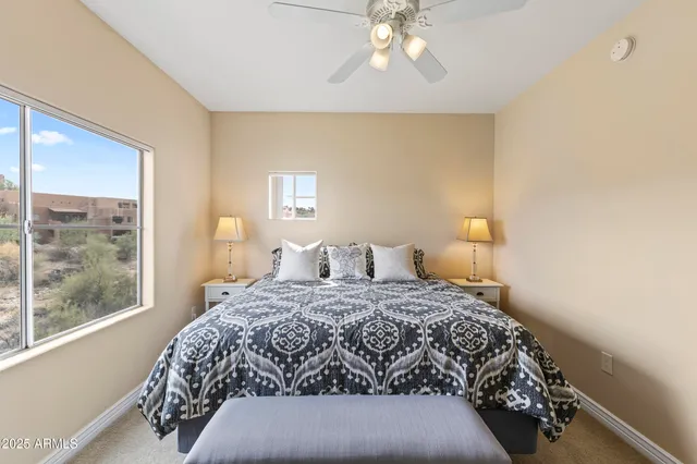 a bedroom with a bed and a window