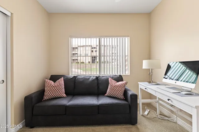 a living room with furniture and a window