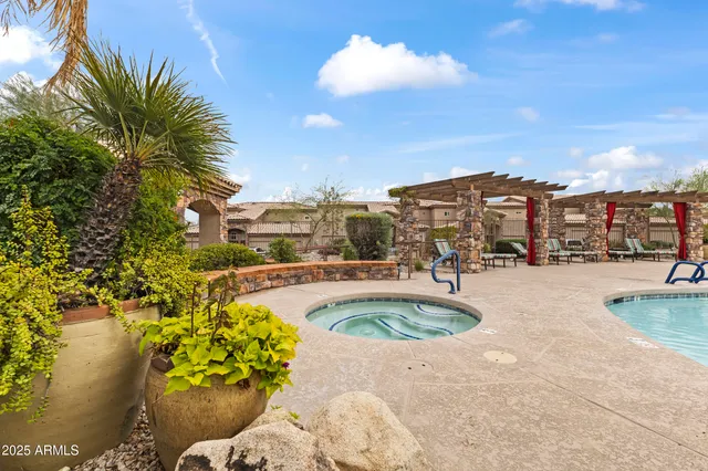 a swimming pool with outdoor seating and yard