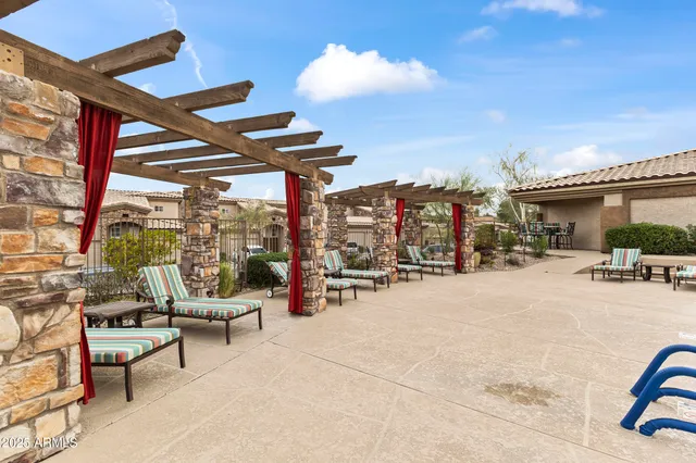 a view of a patio with swimming pool table and chairs