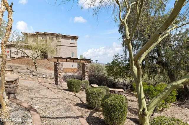 a view of a chairs and table in the patio