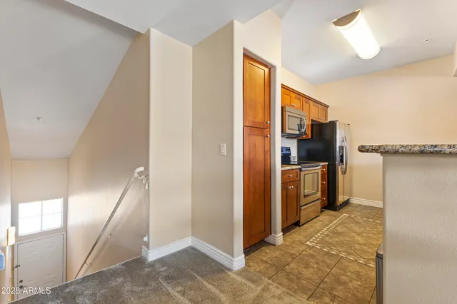 a view of a kitchen with a refrigerator