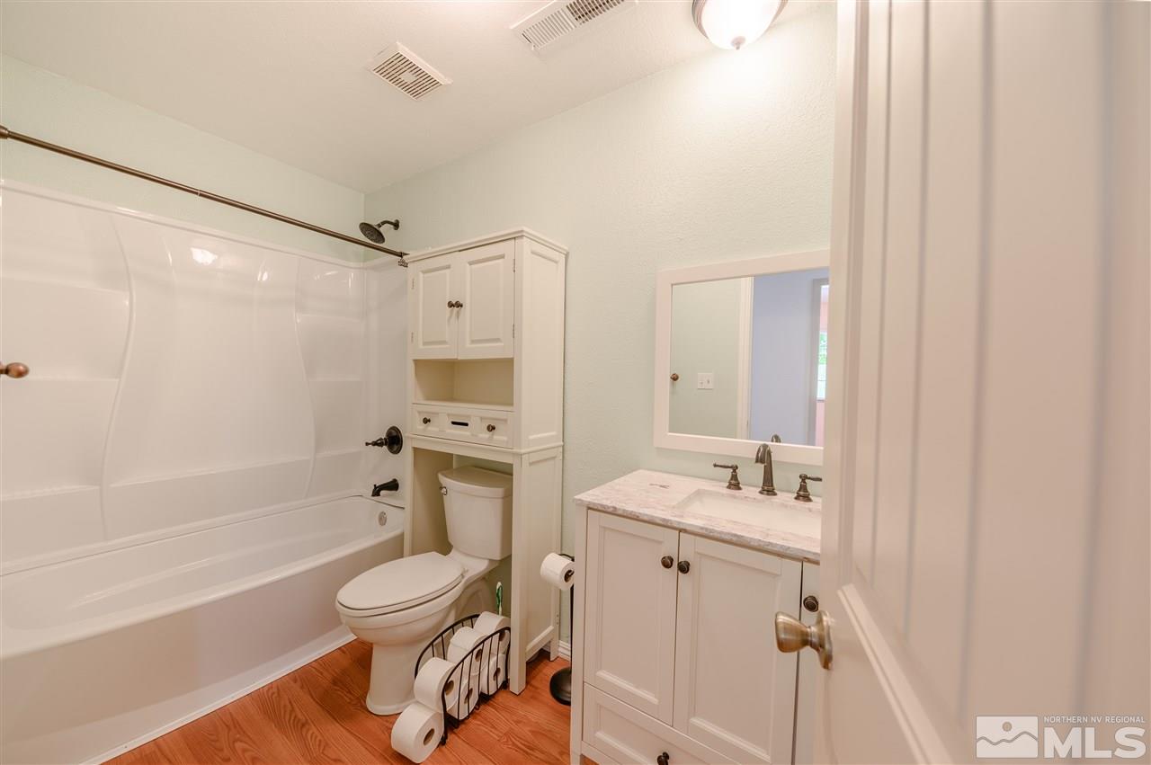 301 Hoge Road Reno, NV 89506 - Photo 13 of 23 a bathroom with a sink toilet tub and shower