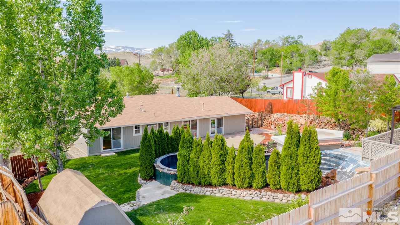 301 Hoge Road Reno, NV 89506 - Photo 22 of 23 a view of a house with a yard and potted plants