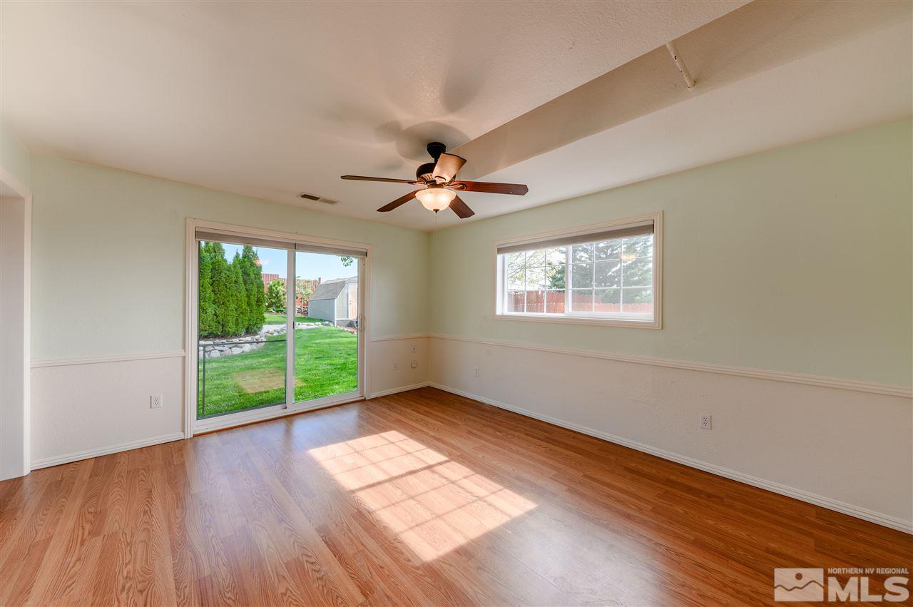 301 Hoge Road Reno, NV 89506 - Photo 3 of 23 wooden floor in an empty room with a window