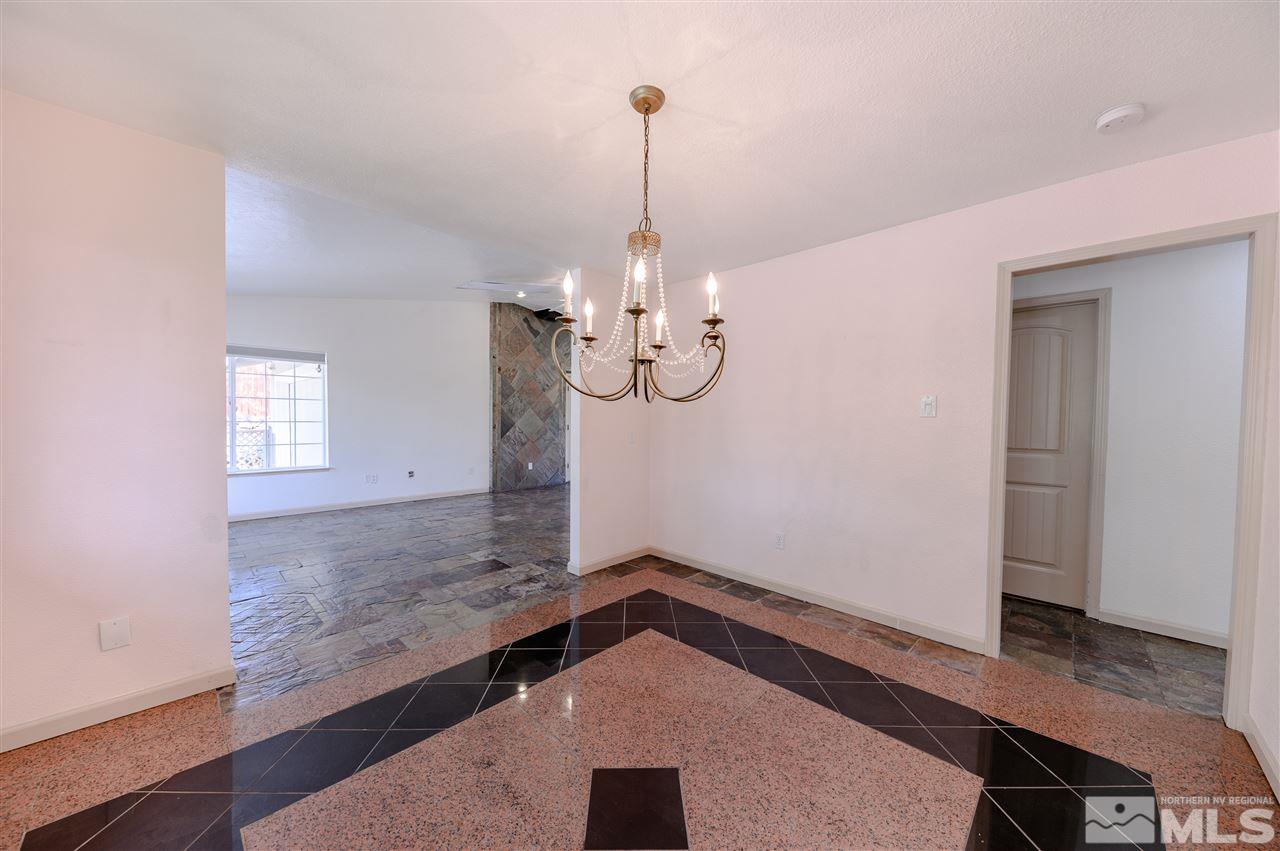 301 Hoge Road Reno, NV 89506 - Photo 4 of 23 a view of a room with window and wooden floor