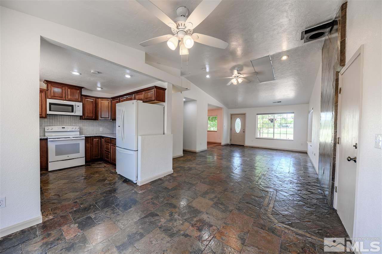 301 Hoge Road Reno, NV 89506 - Photo 7 of 23 a view of a kitchen with a sink and refrigerator