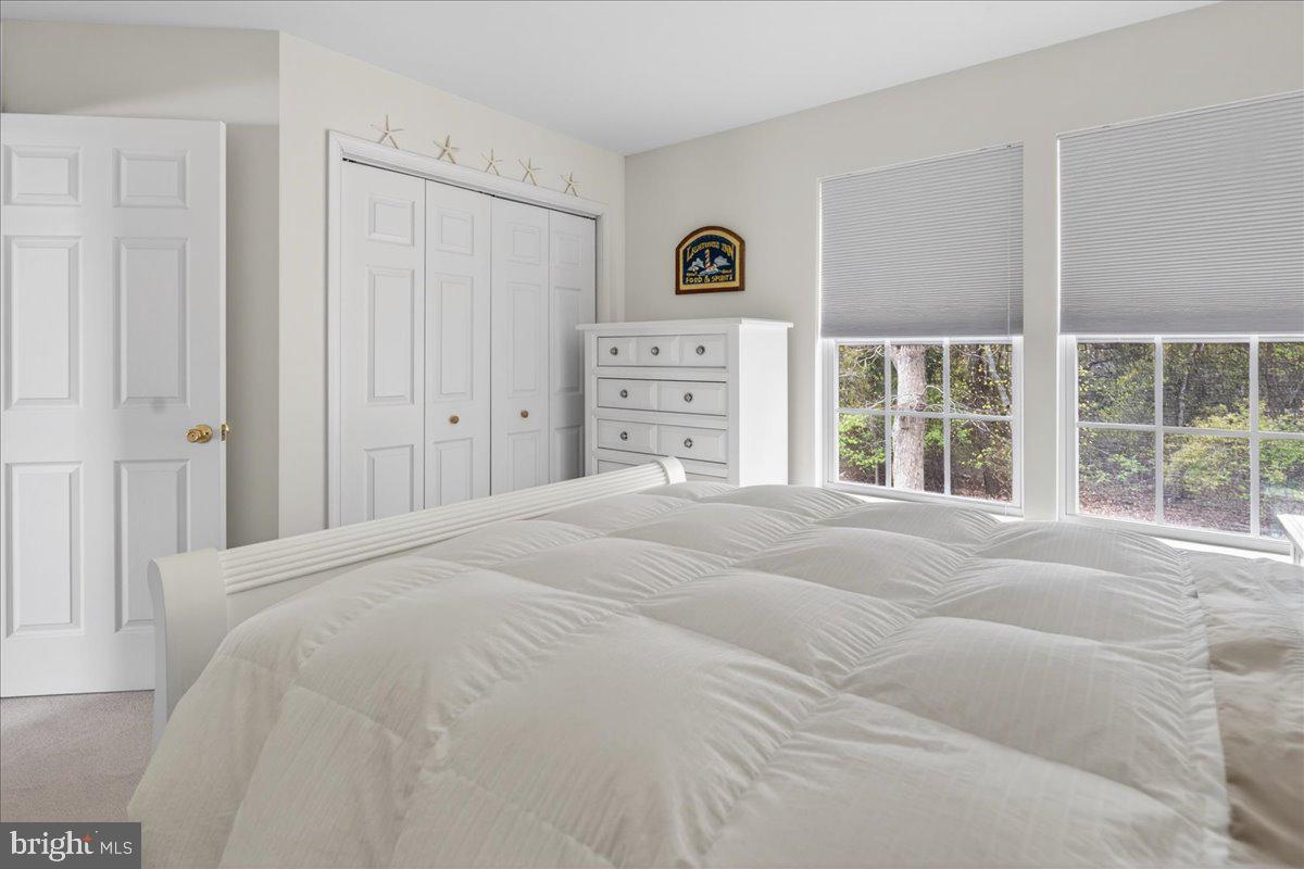 116 Marine Road Waretown, NJ 08758 - Photo 13 of 67 a bedroom with a bed and a window