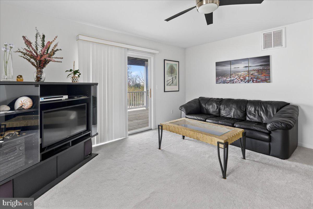 116 Marine Road Waretown, NJ 08758 - Photo 17 of 67 a living room with furniture a flat screen tv and a fireplace