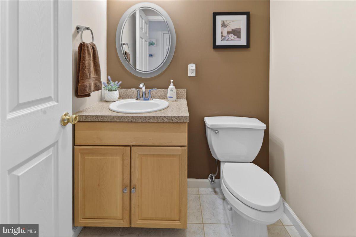116 Marine Road Waretown, NJ 08758 - Photo 19 of 67 a bathroom with a toilet sink vanity and mirror