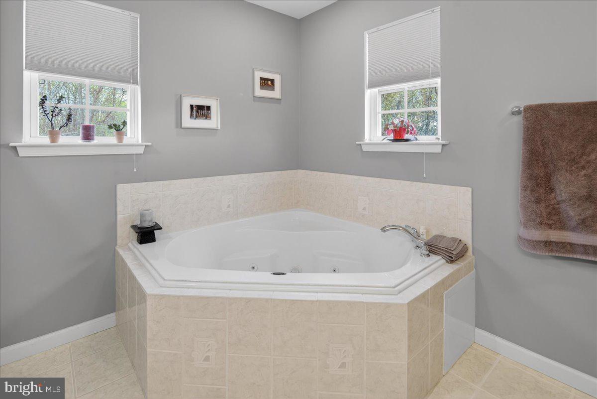 116 Marine Road Waretown, NJ 08758 - Photo 25 of 67 a white bath tub sitting next to a window
